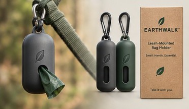 A charcoal leash-mounted EarthWalk holder clipped to a leash, with spare holders and the kraft box.