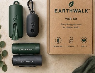 EarthWalk walk kit with dispenser, leash holder, and rolls beside the kraft box.